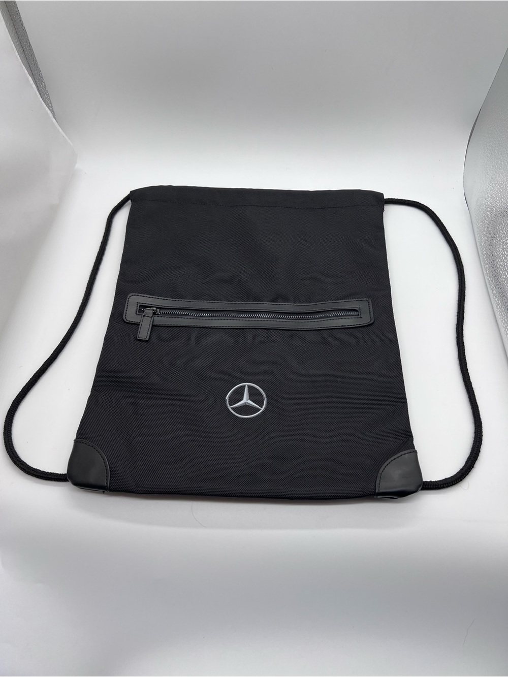 Black Drawstring Backpack with Front Zip Pocket Mercedes Benz Logo